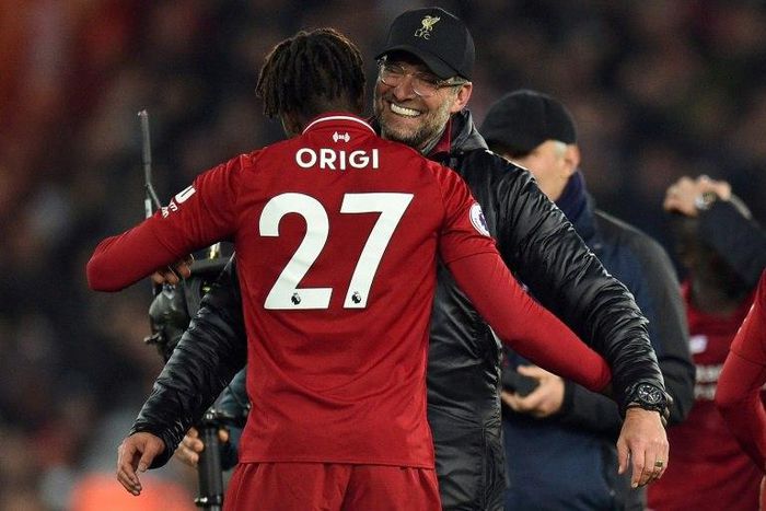 Liverpool manager Jurgen Klopp embraces foward Divock Origi after his late winner against Everton