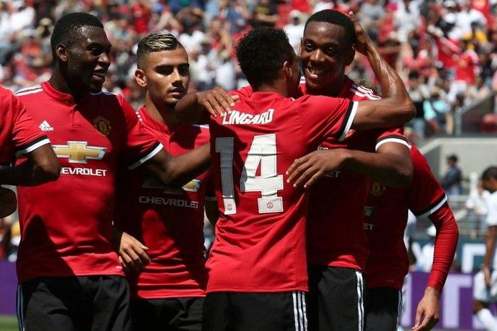 Manchester United forward Anthony Martial (R) celebrates with midfielder Jesse Lingard after Lingard scored a goal on July 23, 2017 in Santa Clara, California