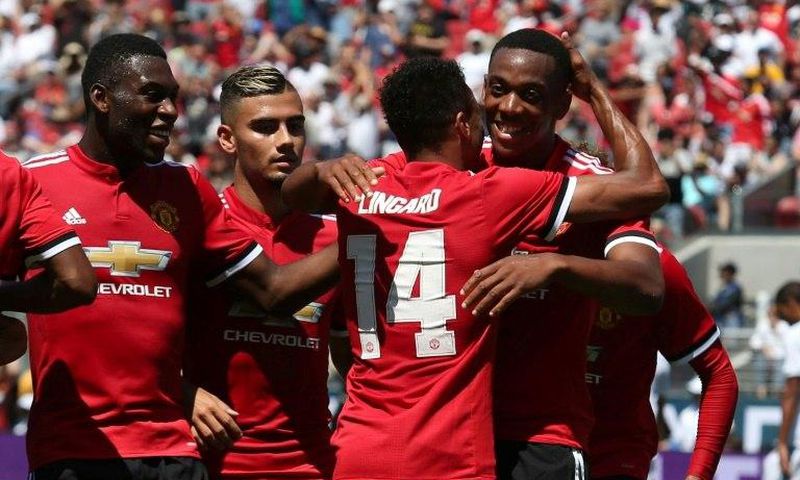 Manchester United forward Anthony Martial (R) celebrates with midfielder Jesse Lingard after Lingard scored a goal on July 23, 2017 in Santa Clara, California