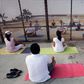 In this Sunday, June 22, 2008 photo, residents practice yoga on both sides of the U.S.-Mexico border fence as they take part in the "Yoga without borders" encounter in Tijuana, Mexico.