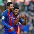 Barcelona's Luis Suarez celebrates with team-mate Lionel Messi after scoring against Las Palmas at the Camp Nou stadium in Barcelona on January 14, 2017