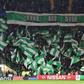 Celtic fans hold up team flags in the stands during the UEFA Champions League group stage football match between Celtic and Barcelona at Celtic Park in Glasgow on November 23, 2016
