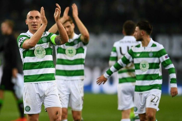 Celtic's Scott Brown (L) celebrates with teammates after their UEFA Champions league Group C 1-1 draw with Borussia Gladbach, in Moenchengladbach, western Germany, on November 1, 2016
