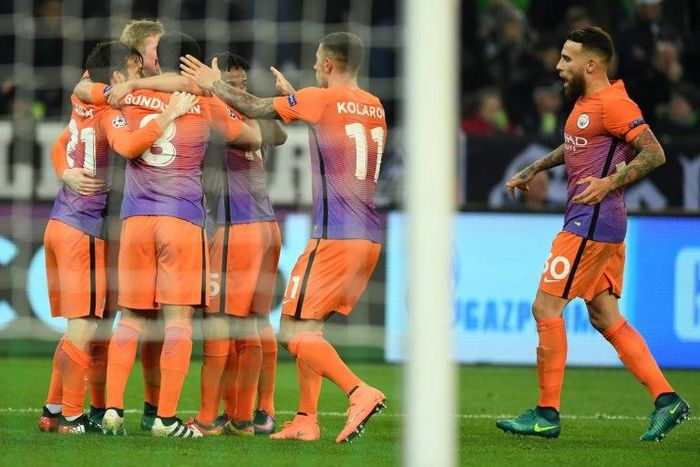Manchester City's players celebrate equalizing during the UEFA group C Champions League football match between Borussia Moenchengladbach and Manchester City on November 23, 2016
