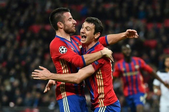 CSKA Moscow's Alan Dzagoev (R) celebrates with teammate Zoran Tosic after scoring a goal during an UEFA Champions League match, in December 2016