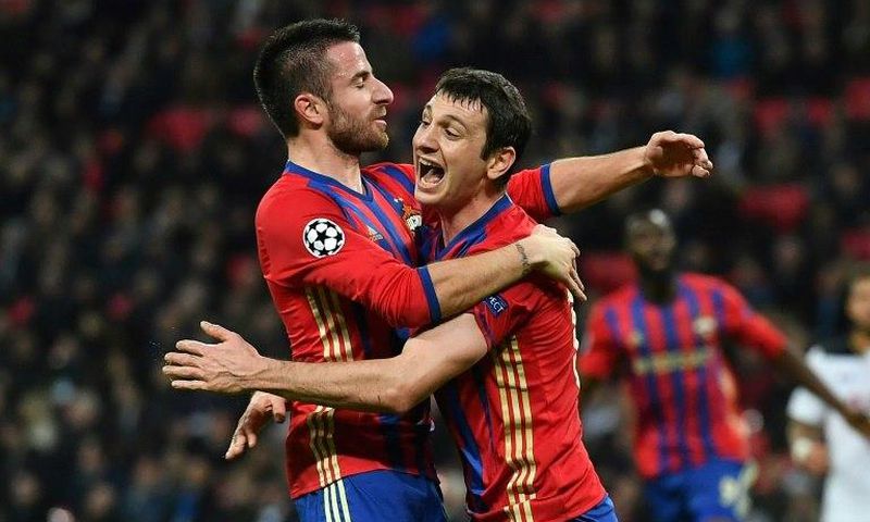 CSKA Moscow's Alan Dzagoev (R) celebrates with teammate Zoran Tosic after scoring a goal during an UEFA Champions League match, in December 2016