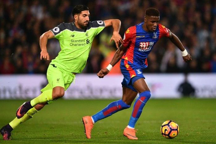 Crystal Palace's striker Wilfried Zaha (R) vies with Liverpool's midfielder Emre Can during the English Premier League football match between Crystal Palace and Liverpool at Selhurst Park in south London on October 29, 2016