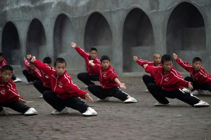 Students practise wushu at the Tagou martial arts school in Dengfeng