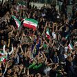 Iran's supporters celerbate their opening goal during the 2018 World Cup qualifying football match between Iran and South Korea at the Azadi Stadium in Tehran on October 11, 2016