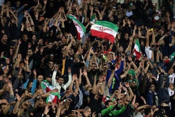 Iran's supporters celerbate their opening goal during the 2018 World Cup qualifying football match between Iran and South Korea at the Azadi Stadium in Tehran on October 11, 2016