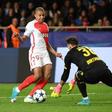 Dortmund's Swiss goalkeeper Roman Burki (R) tries to grab ball from Monaco's French forward Kylian Mbappe during the Champions League quarter-final second leg at the Louis II stadium in Monaco on April 19, 2017