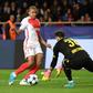 Dortmund's Swiss goalkeeper Roman Burki (R) tries to grab ball from Monaco's French forward Kylian Mbappe during the Champions League quarter-final second leg at the Louis II stadium in Monaco on April 19, 2017