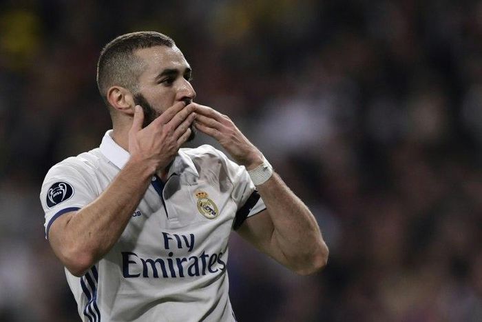 Real Madrid's forward Karim Benzema celebrates a goal during the UEFA Champions League football match Real Madrid CF vs Borussia Dortmund at the Santiago Bernabeu stadium in Madrid on December 7, 2016