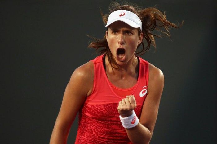 Johanna Konta of Great Britain celebrates withdraws from the WTA Charleston event due to injury