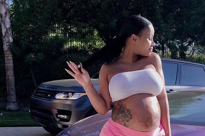 Blac Chyna flaunts bare baby bump, natural hair