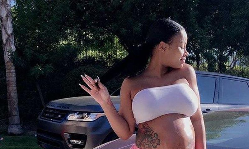 Blac Chyna flaunts bare baby bump, natural hair