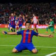 Barcelona's Uruguayan forward Luis Suarez celebrates after scoring the opener during the Spanish Copa del Rey semi final second leg football match against Club Atletico de Madrid at the Camp Nou stadium in Barcelona on February 7, 2017
