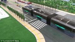 The scale model of the 'Transit Elevated Bus' was demonstrated this week at the 19th China Beijing International High-Tech Expo (pictured). The idea is that passengers sit far above other vehicles on the road, allowing cars to pass underneath 