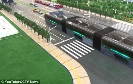 The scale model of the 'Transit Elevated Bus' was demonstrated this week at the 19th China Beijing International High-Tech Expo (pictured). The idea is that passengers sit far above other vehicles on the road, allowing cars to pass underneath 