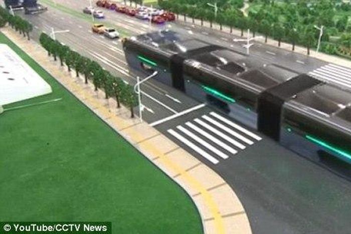 The scale model of the 'Transit Elevated Bus' was demonstrated this week at the 19th China Beijing International High-Tech Expo (pictured). The idea is that passengers sit far above other vehicles on the road, allowing cars to pass underneath 