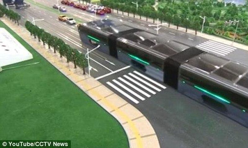 The scale model of the 'Transit Elevated Bus' was demonstrated this week at the 19th China Beijing International High-Tech Expo (pictured). The idea is that passengers sit far above other vehicles on the road, allowing cars to pass underneath 
