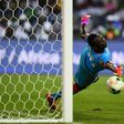 Burkina Faso's goalkeeper Herve Kouakou Koffi stops the ball during the penalty shootout of the 2017 Africa Cup of Nations semi-final football match against Egypt at the Stade de l'Amitie Sino-Gabonaise in Libreville on February 1, 2017