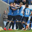 Hoffenheim's defender Niklas Suele (2ndL) celebrates scoring with teammates on October 30, 2016
