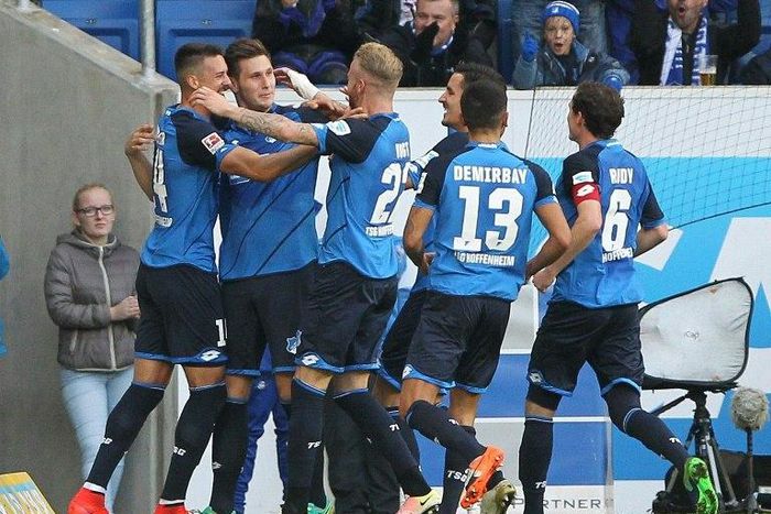 Hoffenheim's defender Niklas Suele (2ndL) celebrates scoring with teammates on October 30, 2016