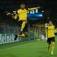 Dortmund's forward Pierre-Emerick Aubameyang (L) celebrates scoring the opening goal with his teammates during the UEFA Champions League Round of 16, 2nd-leg football match Borussia Dortmund v SL Benfica in Dortmund, western Germany on March 8, 2017