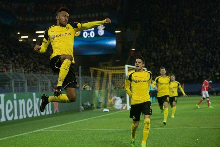 Dortmund's forward Pierre-Emerick Aubameyang (L) celebrates scoring the opening goal with his teammates during the UEFA Champions League Round of 16, 2nd-leg football match Borussia Dortmund v SL Benfica in Dortmund, western Germany on March 8, 2017