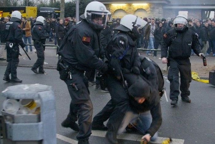 A video grab shows a fan being taken into custody ahead the German First division Bundesliga football match between Borussia Dortmund and RB Leipzig in Dortmund, western Germany, on February 4, 2017