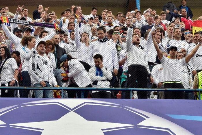 Real Madrid fans cheer their team before their UEFA Champions League semifinal second leg football match against Club Atletico de Madrid at the Vicente Calderon stadium in Madrid, on May 10, 2017