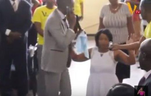 Pastor Paul Sanyangore on the phone with God