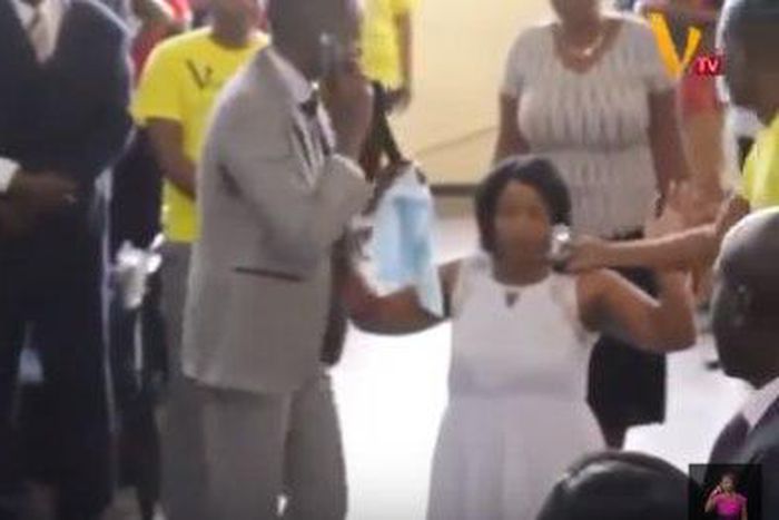 Pastor Paul Sanyangore on the phone with God