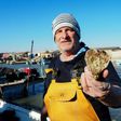 French oyster farmer Christophe Guinot shows a heart-shaped oyster that he produces and sells on Saint Valentine's Day.