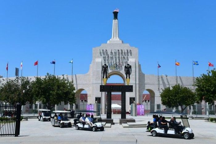 International Olympic Committee officials, and LA 2024 officials, including LA Mayor Eric Garcetti, leave on golf carts following a tour at the Los Angeles Memorial Coliseum as the IOC Evaluation Commission continues with its visit to Los Angeles