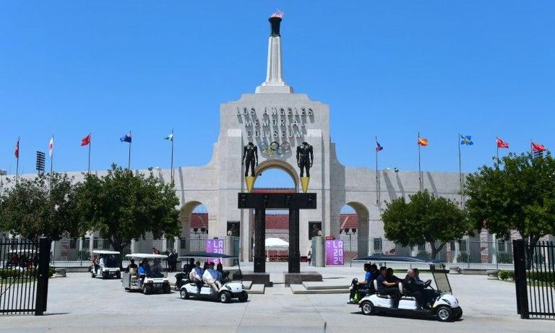 International Olympic Committee officials, and LA 2024 officials, including LA Mayor Eric Garcetti, leave on golf carts following a tour at the Los Angeles Memorial Coliseum as the IOC Evaluation Commission continues with its visit to Los Angeles