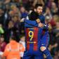 Barcelona's forward Lionel Messi (R) celebrates with Barcelona's forward Luis Suarez after scoring a goal during the Spanish league football match FC Barcelona vs Real Sociedad at the Camp Nou stadium in Barcelona on April 15, 2017