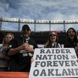 Oakland Raiders fans hold signs before the game against the Denver Broncos at Sports Authority Field at Mile High on January 1, 2017 in Denver, Colorado