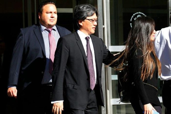 After pleading guilty to fraud and conspiracy charges, former president of the Costa Rican Football Federation Eduardo Li (C) leaves the Court of the Eastern District of New York on October 7, 2016