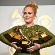Adele holds five Grammy trophies, including the top two awards of the night, Album and Record of the Year for her blockbuster hit "Hello" and the album "25"