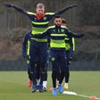 Arsenal's German defender Per Mertesacker (L) and English midfielder Theo Walcott take part in training on the eve of their Champions League round of 16 first leg against Bayern Munich at Arsenal's London Colney training ground on February 14, 2017