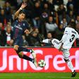 Paris Saint-Germain's forward Angel Di Maria (L) challenges Basel's defender Adama Traore during the UEFA Champions League group A football match between Paris Saint-Germain (PSG) and Basel at the Parc des Princes stadium in Paris on October 19, 2016