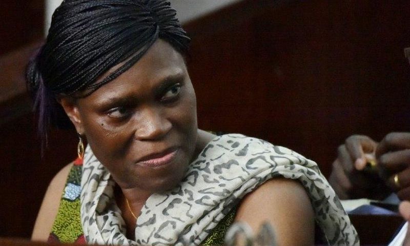 Former Ivorian first lady Simone Gbagbo looks on at Abidjan's courthouse on October 10, 2016 before the re-opening of her trial