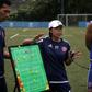 Head coach of Eastern FC, Chan Yuen-ting, talks to her players during a training session in Hong Kong
