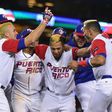 Eddie Rosario of Puerto Rico celebrates with teammates after getting the game-winning hit in the 11th inning for a 4-3 win over the Netherlands, at Dodger Stadium in Los Angeles, on March 20, 2017