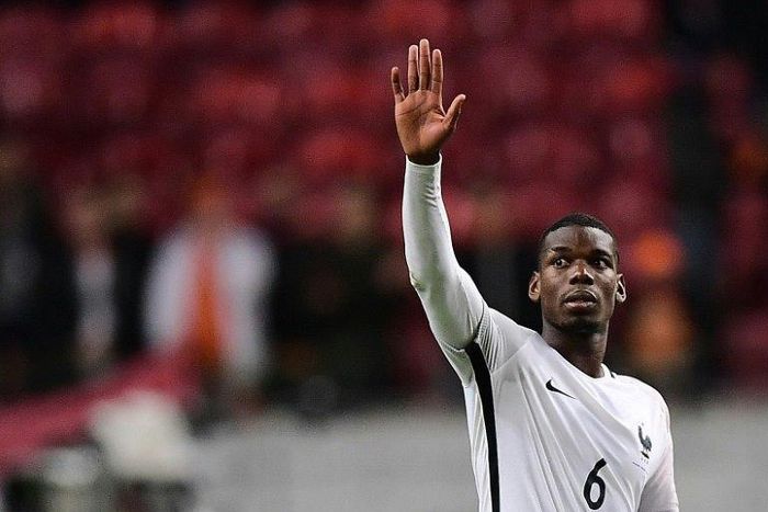 France's midfielder Paul Pogba celebrates his team's victory on October 10, 2016