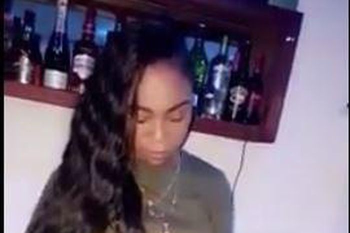 Shatta Michy cleaning the glass cups with the same tissue paper she used for to wipe her lips