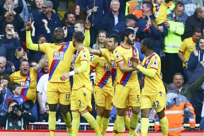 Crystal Palace's striker Christian Benteke (L) celebrates scoring a goal against Liverpool with Joel Ward (2ndL), James Tomkins (2ndR) and Jason Puncheon on April 23, 2017