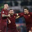 Roma's midfielder Radja Nianggolan (C) celebrates with teammates after scoring during the Italian Serie A football match Roma vs AC Milan at the Olympic Stadium in Roma on December 12, 2016